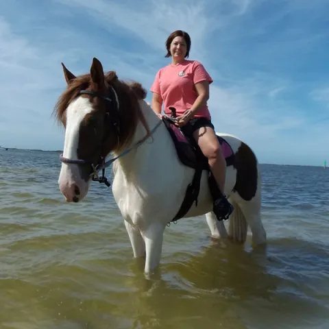 A woman riding horseback