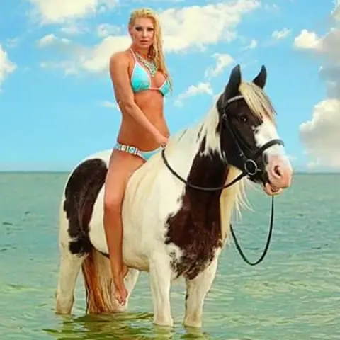 A woman riding horseback