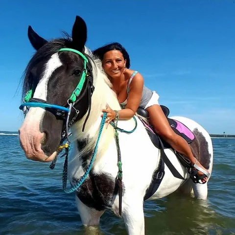 A woman riding horseback