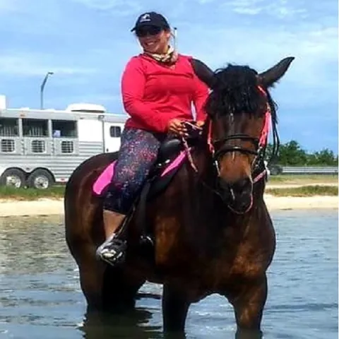 A woman riding horseback