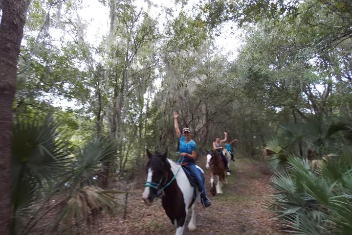 A tour group riding through Alafia state park