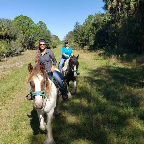 Two women enjoying a trail ride on the Deer Prairie Creek Trail