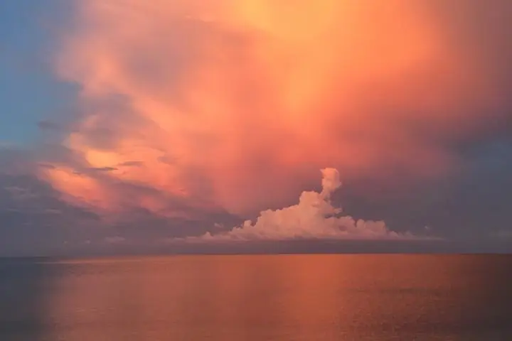 a sunset over a body of water